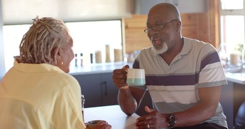 Happy Senior Couple Enjoying Coffee and Conversation - Download Free Stock Images Pikwizard.com