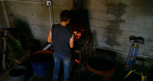 Person Tending Forge in Rustic Workshop - Download Free Stock Images Pikwizard.com