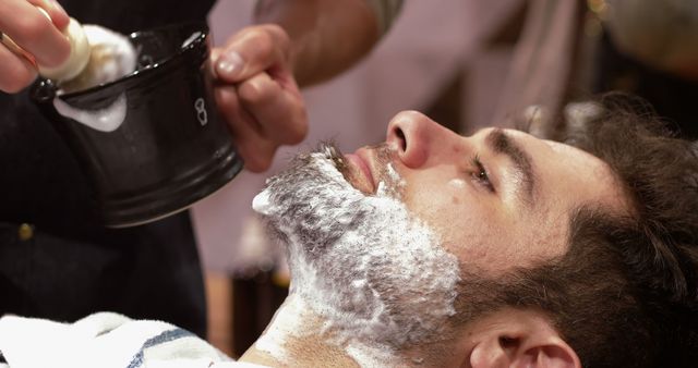 Man Getting Shaving Foam Applied by Barber at Barbershop - Download Free Stock Images Pikwizard.com