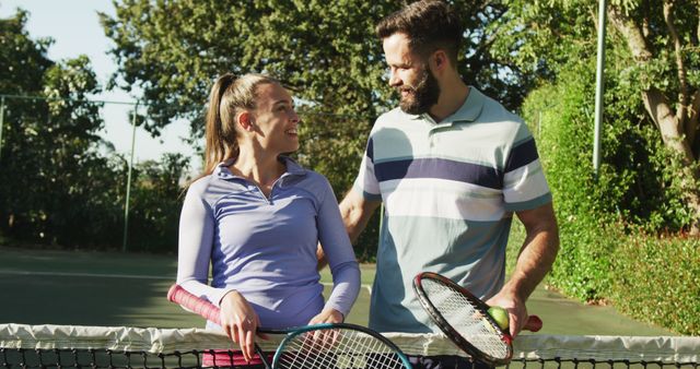 Image of happy caucasian couple on the court. Healthy active lifestyle and fitness at home.