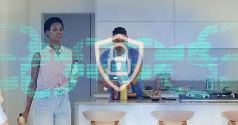 Office colleagues prepping lunch in modern kitchen with cybersecurity lock hologram overlay