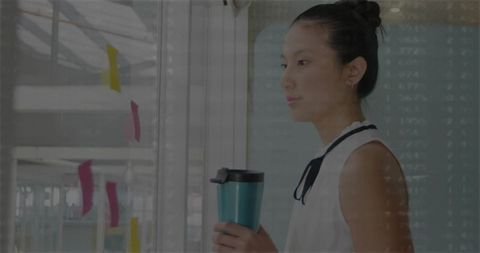 Focused businesswoman planning strategy with sticky notes in modern office