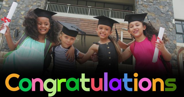 Image of congratulations text over happy diverse schoolgirls with mortar boards and diplomas. Achievement, graduation, school, childhood, education and learning, digitally generated image.