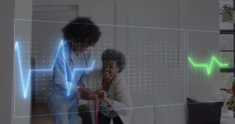 Heart rate monitoring with female medical professional assisting senior woman