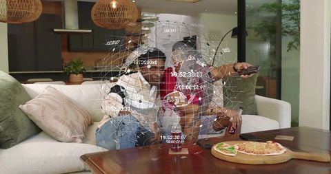 Friends watching tv sharing pizza viewing holographic ar globe on living room sofa