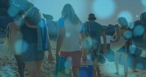 Friends Visiting Tranquil Beach Together for Relaxation and Leisure