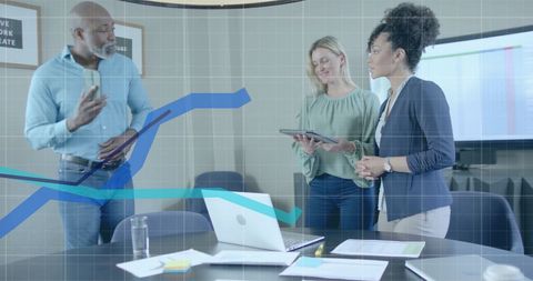 Diverse Team Collaborating Over Digital Financial Data in Modern Office