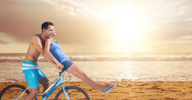 Digital composite of Happy couple riding bicycle at beach