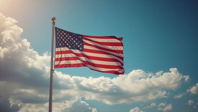 American Flag Wave Against Cloud-Spotted Sky in Sunlight
