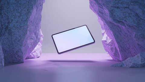 Futuristic Tablet Floating in Rocky Corridor with Illuminated Screen