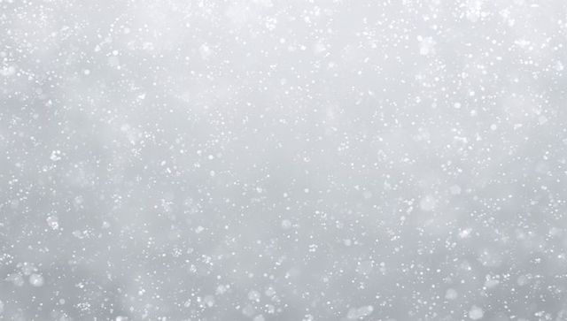 Soft falling snowflakes overcast sky minimal winter background with bokeh texture