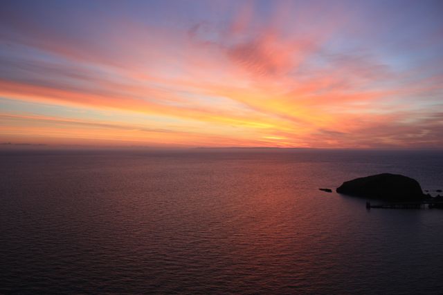 Vibrant Sunset Over Calm Ocean with Gentle Waves - Download Free Stock Photos Pikwizard.com