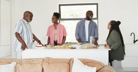 Family Enjoying Cooking and Fun Times in Bright Kitchen