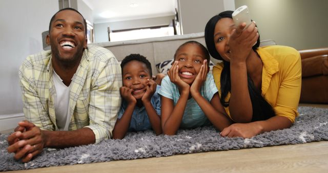 Happy Family Watching TV Together on Carpet in Home Living Room - Download Free Stock Images Pikwizard.com