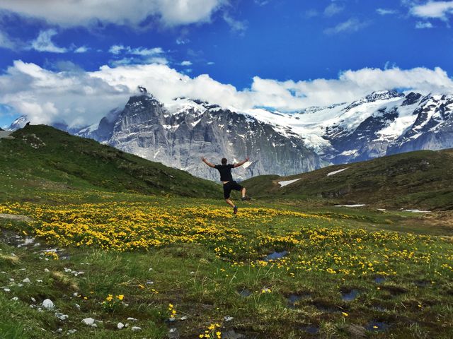 Carefree Man Enjoying Nature with Majestic Mountain Range in Background - Download Free Stock Photos Pikwizard.com