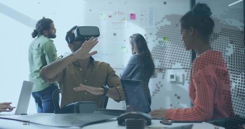 Team Collaborating with Virtual Reality in Modern Meeting Room