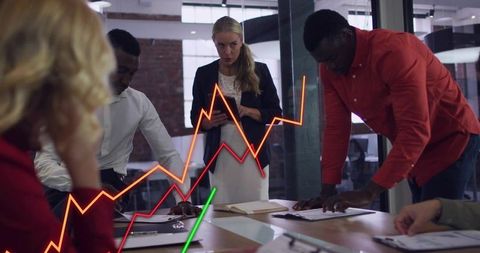Dynamic Team Analyzing Growth Charts in Modern Boardroom Meeting with Data Overlays