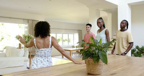 Diverse Friends Admiring Modern Living Room Decorating Ideas