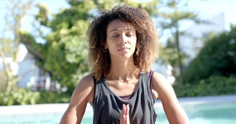 Biracial Woman Meditating in Sunny Garden for Wellbeing - Download Free Stock Images Pikwizard.com