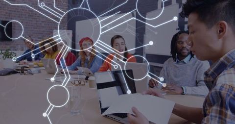 Multicultural team collaborates on digital technology connections