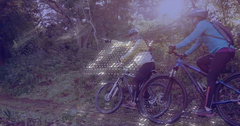 Mountain bikers exploring forest trail