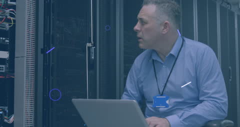 Technician Analyzing Data in a Secure Server Room Environment