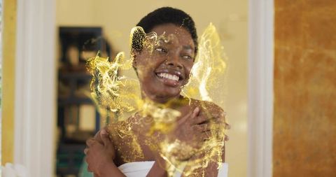 Joyful wellness moment with golden sparkles and elegance