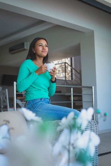 Happy Biracial Woman Enjoying Coffee at Home - Download Free Stock Images Pikwizard.com