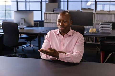 Businessman in Modern Office utilizing Efficient Communication