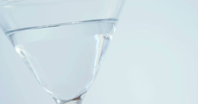 Close-up of Martini Glass with Water on Light Background - Download Free Stock Images Pikwizard.com