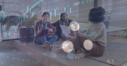 Diverse team brainstorming with digital data projection overlay