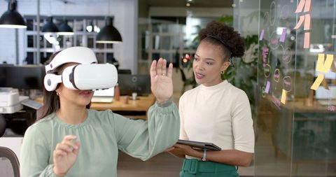 Diverse Office Team Using VR Technology for Collaboration