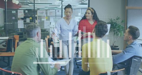 Multiracial Team Analyzing Business Data in Modern Office