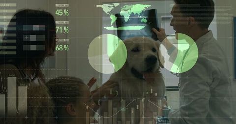 Veterinarian Reviewing X-Ray with Pet Owners and Golden Retriever