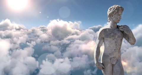 Classic Stone Sculpture Against a Majestic Cloudy Sky
