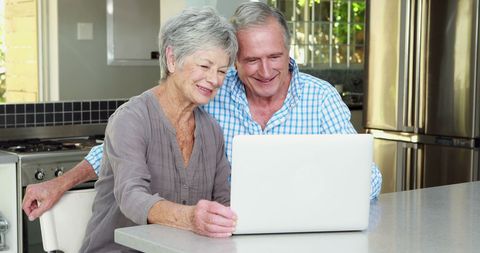Senior Couple Video Calling on Laptop in Modern Kitchen - Download Free Stock Images Pikwizard.com