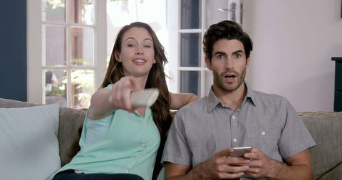 Couple Relaxation with TV and Smartphone at Home