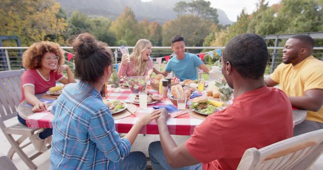 Diverse Group of Friends Enjoying Outdoor Meal Together - Download Free Stock Images Pikwizard.com