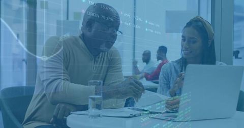 Advisor and Woman Discussing Financial Data at Office Lounge