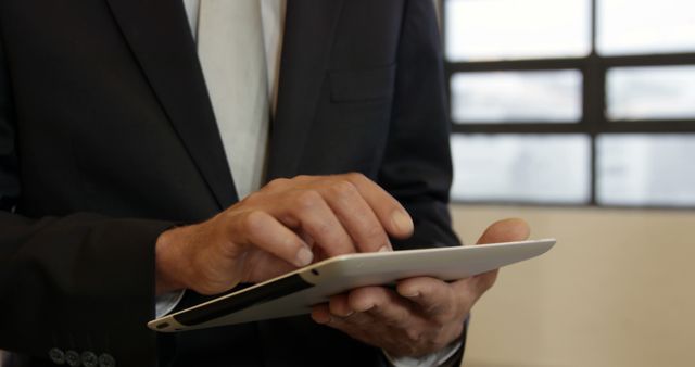 Businessman Using Digital Tablet in Office Environment - Download Free Stock Images Pikwizard.com