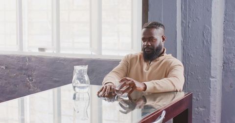 Professional Man Hydrating in Modern Office Environment