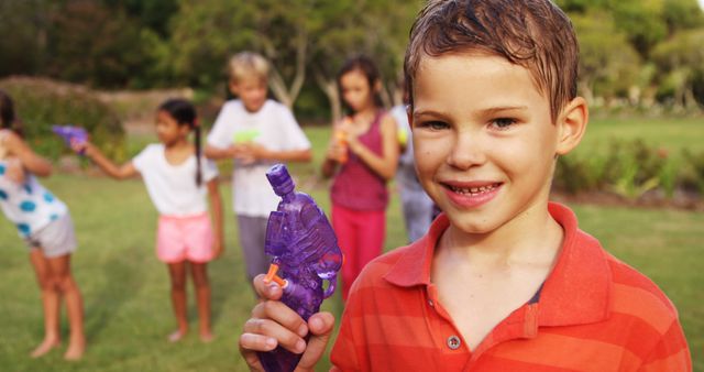 Happy Children Playing with Water Guns in Summer Garden - Download Free Stock Images Pikwizard.com