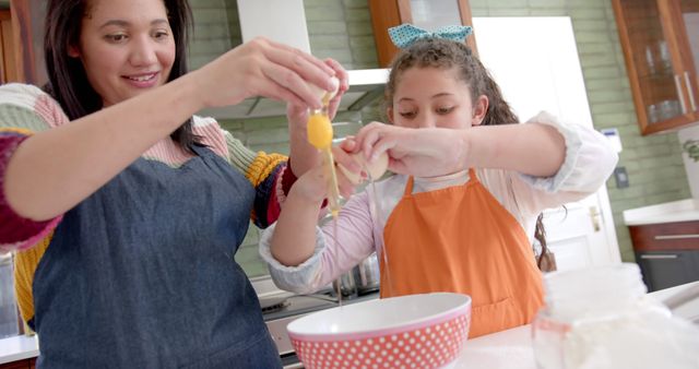 Mother and Daughter Cracking Eggs in Modern Kitchen - Download Free Stock Images Pikwizard.com