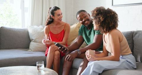Diverse Friends Enjoy Relaxed Conversation at Home