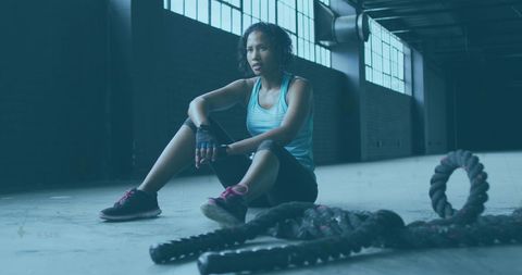 Fit African American Woman Resting in Industrial Gym Setting - Download Free Stock Images Pikwizard.com