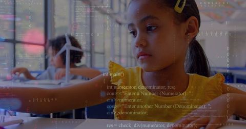 Young student engaging with wind turbine model stem exploration