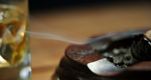 Cigar Ashtray and Whiskey Glass with Smoky Ambiance - Download Free Stock Images Pikwizard.com