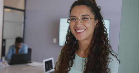 Smiling Creative Businesswoman in Modern Office Environment