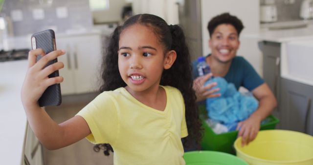 Smiling Father and Daughter Video Calling While Recycling at Home - Download Free Stock Images Pikwizard.com