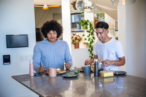 Diverse Friends Enjoying Breakfast with Avocado Toast and Coffee